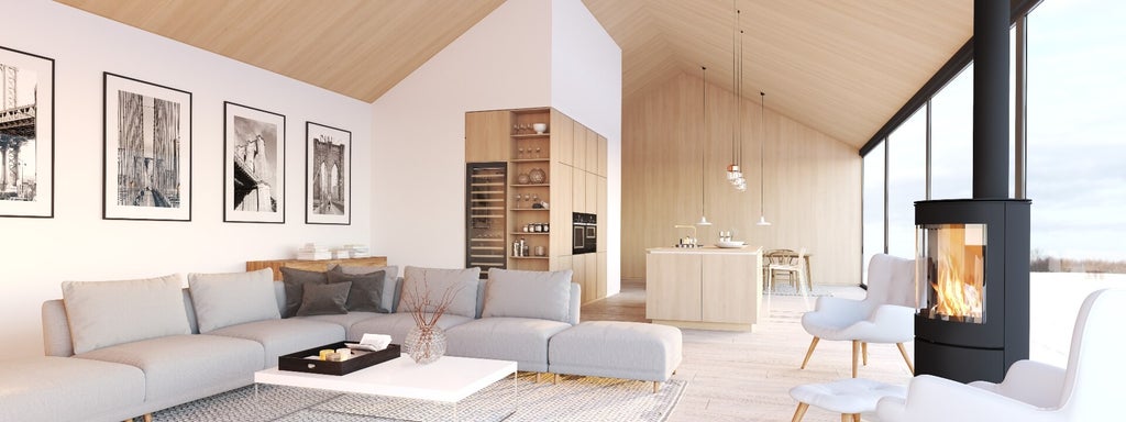 Scandinavian furniture creates a strong home aesthetic in this well-lit Brooklyn penthouse.